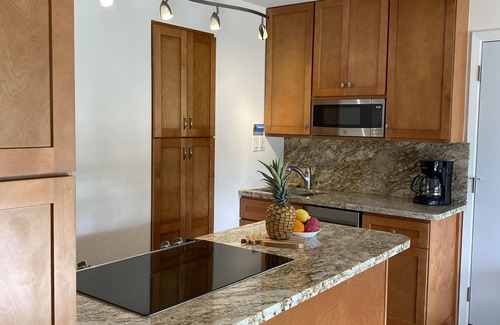 Kihei Condo | Discounted! Partial ocean view condo with pool & just steps to beach.