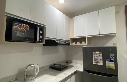 Pallocan Condo | Discover Comfort in the City - Cozy 1 Bedroom Condo Awaits