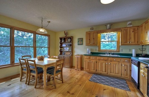 Ellijay Cabin | Discover River Bluff Retreat, a Pet-friendly haven with riverfront access for tubing and fishing, plus hot tub, outdoor fireplace, dock, and WiFi.