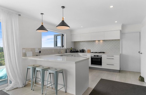 Mangawhai House | Divinity Olives - Large, stylish, sunny holiday home in a beautiful rural setting