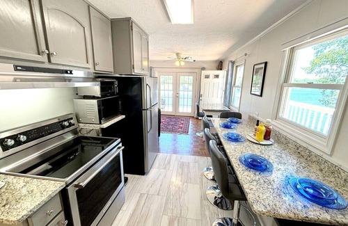 North Shore House | Dock Days- Deep water and fantastic wide water views. Volley Ball and horseshoe competitions await.