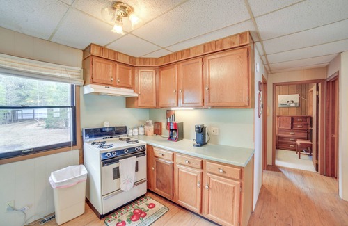 Gould City Cottage | Dock & Fire Pit: Lakefront Cottage in Gould City!