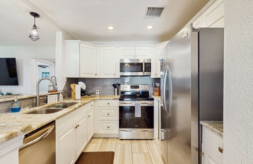 Riverside Heights House | Dog-friendly bungalow with a fenced yard, deck, washer/dryer, & AC