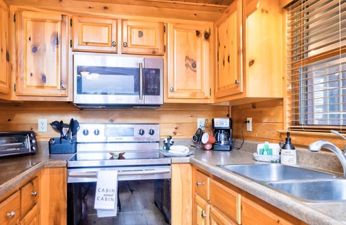Cashes Valley Cabin | Dog-friendly cabin with game room, fireplace, furnished deck, & washer/dryer