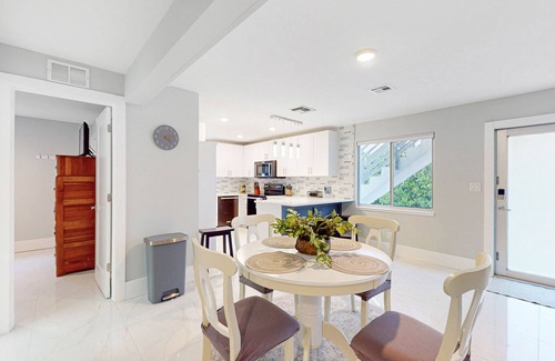 Isles of Capri Condo | Dog-friendly colorful condo with shaded patio, washer/dryer, & central AC