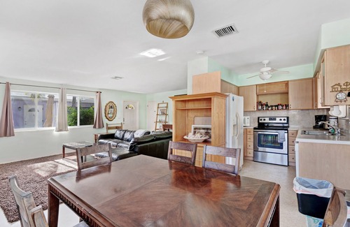 North Beach House | Dog-friendly duplex with communal patio, dining area, & grill