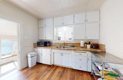 Harrison House | Dog-friendly getaway with large deck & lake view - walk to shops & marina
