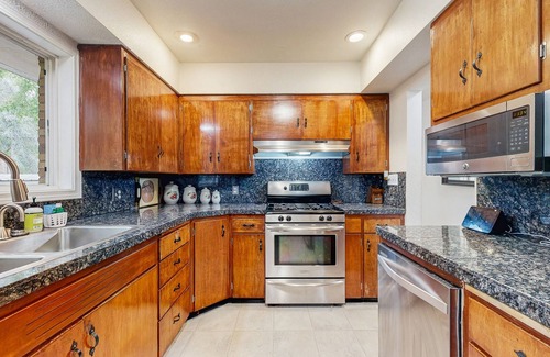 Metzger House | Dog-friendly home on 1/2 acre with creek access, game room & 2 fireplaces
