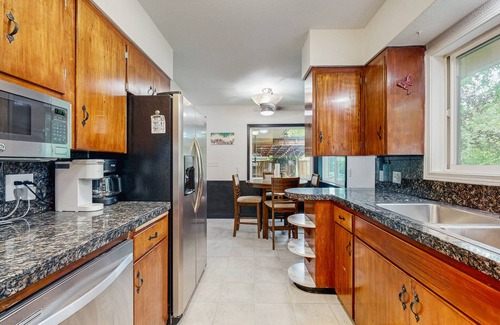Metzger House | Dog-friendly home on 1/2 acre with creek access, game room & 2 fireplaces