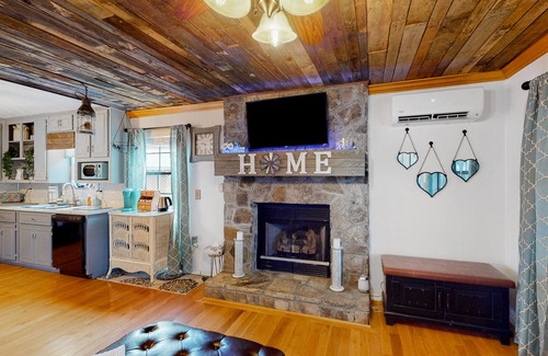 Morganton House | Dog-friendly home with wraparound deck, gas grill & fenced yard