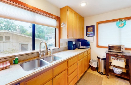 Port Orford House | Dog-friendly lakefront home with lake views, deck, partial AC, & W/D