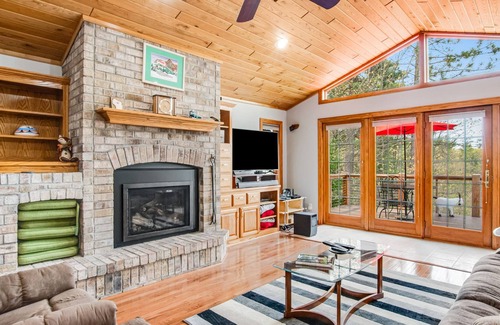 Rhinelander House | Dog-friendly lakefront home with deck, lake views, grill, fireplace, patio, AC