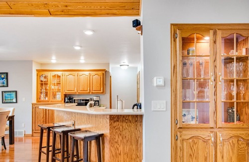 Rhinelander House | Dog-friendly lakefront home with deck, lake views, grill, fireplace, patio, AC