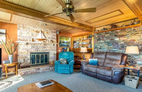 Polson House | Dog-friendly lakefront home & guest house with private beach, dock, & firepit