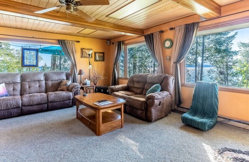 Polson House | Dog-friendly lakefront home & guest house with private beach, dock, & firepit