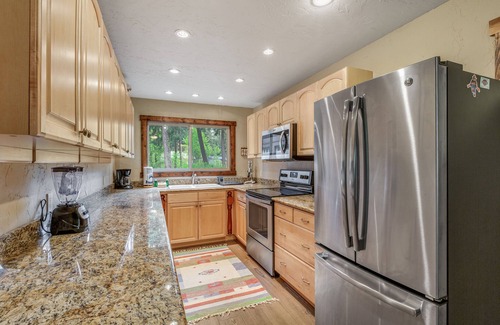 Cle Elum Cabin | Dog-friendly riverfront home with hot tub, large yard, fast WiFi and fireplace
