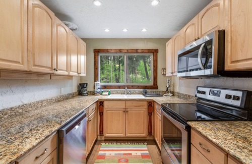 Cle Elum Cabin | Dog-friendly riverfront home with hot tub, large yard, fast WiFi and fireplace