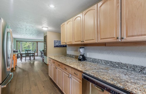 Cle Elum Cabin | Dog-friendly riverfront home with hot tub, large yard, fast WiFi and fireplace