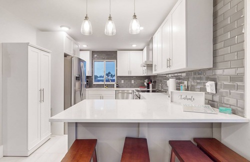 Isles of Capri Condo | Dog-friendly single-level condo with furnished patio, rooftop, & washer/dryer