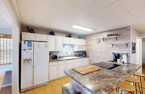 Fort Morgan Pines House | Dog-friendly waterfront retreat with a washer/dryer, AC, patio, & outdoor shower
