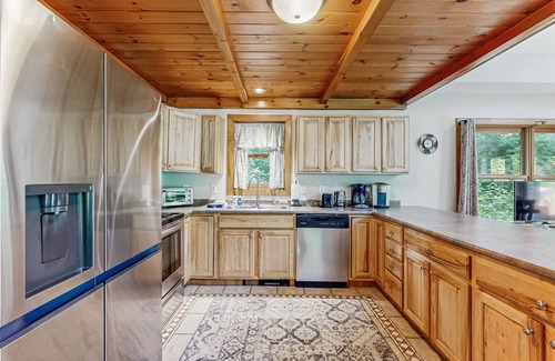 Woodstock House | Dog-friendly wilderness retreat with game room, jetted tub, fireplace & deck