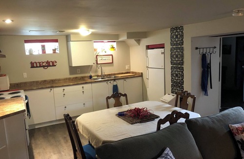 Township of Woolwich Apartment | Doggy heaven. Large fenced yard , beautiful gardens, guest patio and firepit.