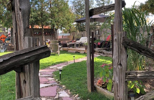 Township of Woolwich Apartment | Doggy heaven. Large fenced yard , beautiful gardens, guest patio and firepit.