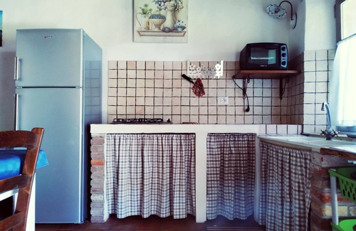 San Giovanni Suergiu House | Domusantiga Apartments 2 DOUBLE BEDROOMS, GREEN MEADOW, by the sea