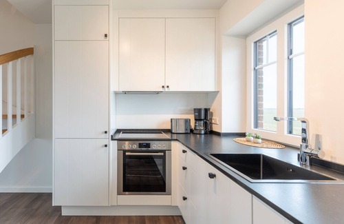 Suden Apartment | Doppelhaushälfte "tinkeltutenhus" auf Nordstrand für bis zu 4 Personen