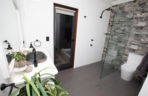 Deer Vale Cabin | Dorrigo accommodation, twin outdoor baths under the stars,120 ac. river & walks
