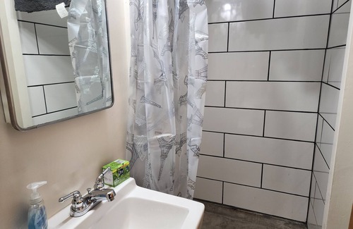 Craig Apartment | Downstairs apt, 2 beds, 3/4 bath, kitchen, washer/dryer. Walk to restaurants.