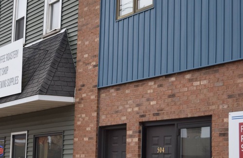 Escanaba Apartment | Downtown Escanaba Gem: Spacious Extended Stay Rental Above Commercial Space!