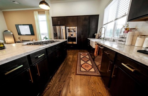 Northside House | Downtown Escape with Backyard, Gameroom and Hot Tub