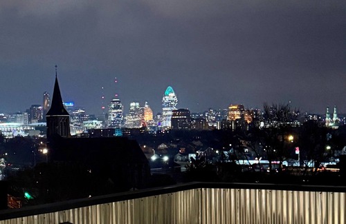 Covington House | Downtown skyline vista featuring giant rooftop deck & wet bar with a city view