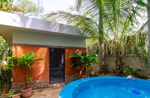Merida Cottage | DRAGONFLY country house with swimming pool and beautiful tropical garden