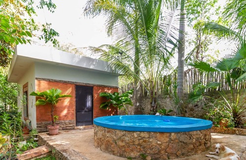 Merida Cottage | DRAGONFLY country house with swimming pool and beautiful tropical garden