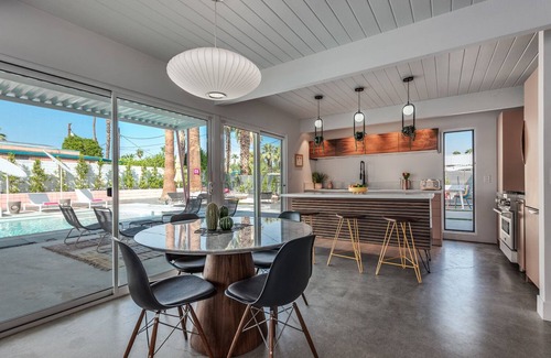 Racquet Club Estates House | Dreamy Mid Century Modern House with Saltwater Pool & Resort Style Backyard