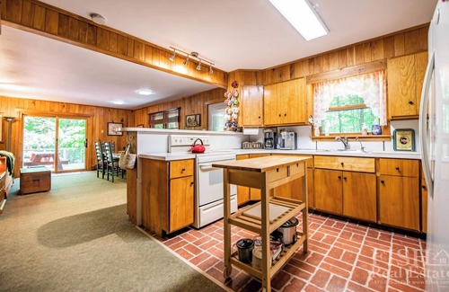 Laporte Cottage | Dual deck overlooking the lake at "Serenity" cottage in Lake Mokoma