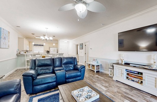Central Myrtle Beach Condo | Dual-suite Magnolia Pointe condo with golf, pools, and screened patio