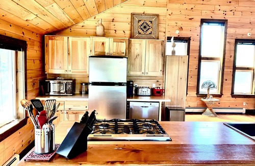 Britt Cottage | Duplex style cottage, 2 kitchens! Nestled in quaint area on River. Dock access!