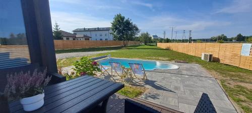 gmina Morawica House | Dwa Wymiary - Całoroczny domek z Jacuzzi i basenem podgrzewany w okresie wiosna - lato w cenie