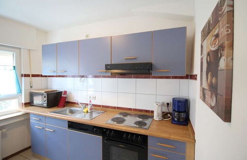 Eitorf Apartment | E06 Workers Apartment in a quiet location in Eitorf with a terrace with a seating area