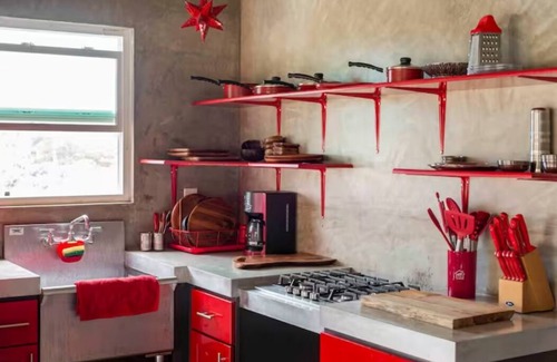Ensenada Apartment | Eclectic Cliffside Den with Hanging Living Area
