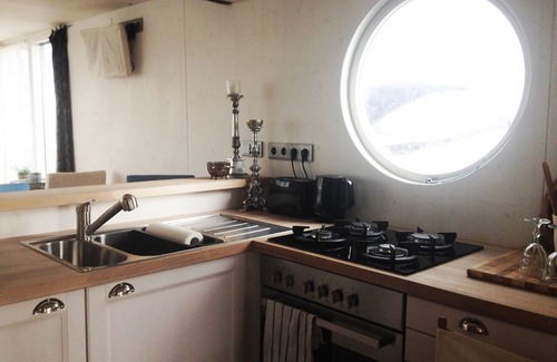 Schleswig Boat Rental | eco-luxury houseboat, natural materials instead of plastics, Baltic Sea fjord