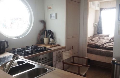 Schleswig Boat Rental | eco-luxury houseboat, natural materials instead of plastics, Baltic Sea fjord