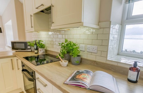 Holyhead Cottage | Efail Penrhyn - an on the beach that sleeps 6 guests in 3 bedrooms