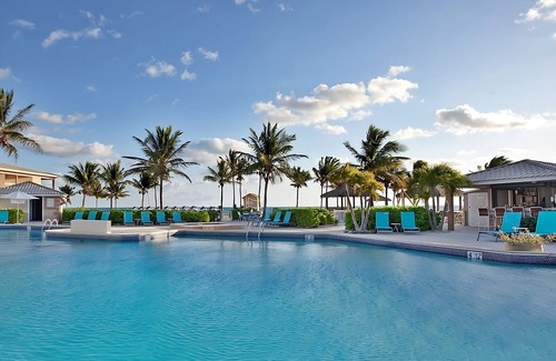 Crystal Harbour Apartment | Elegant 1BR Oceanview Suite w/Full Kitchen, Bar & Relaxing Pool Area
