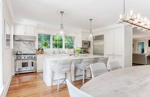 Water Mill House | Elegant Coastal Escape with Expansive Yard, Heated Pool, and Outdoor.