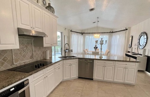Coral Springs House | Elegant home private pool private patio bar with TV on lake