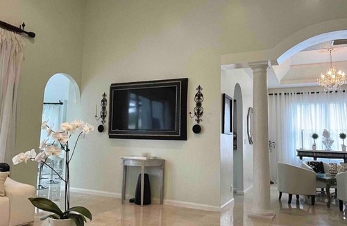 Coral Springs House | Elegant home private pool private patio bar with TV on lake